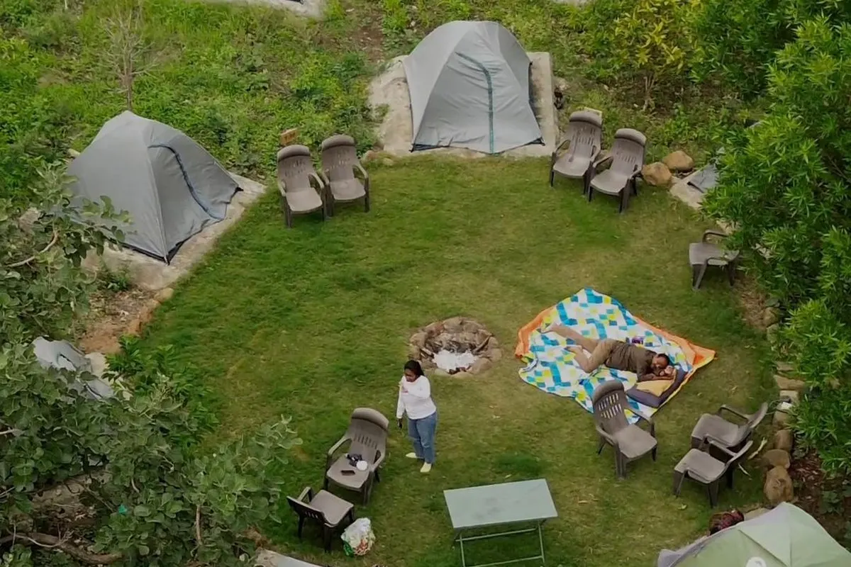 Lakeside camping tents at Sarpanpally Lake, Ananthagiri Hills
