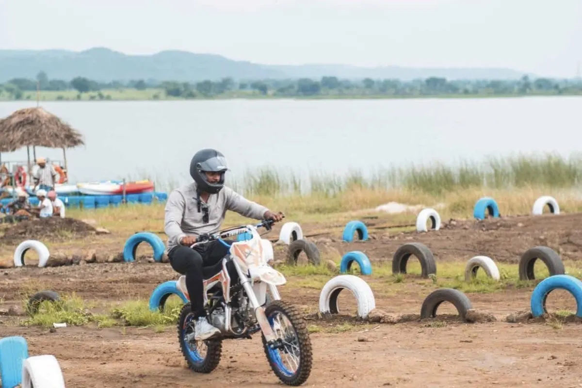 Dirt bike ride by Sarpanpally Lake at the Wilderness campsite